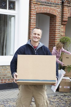 Moving van and packed boxes in a Kidbrooke residential street