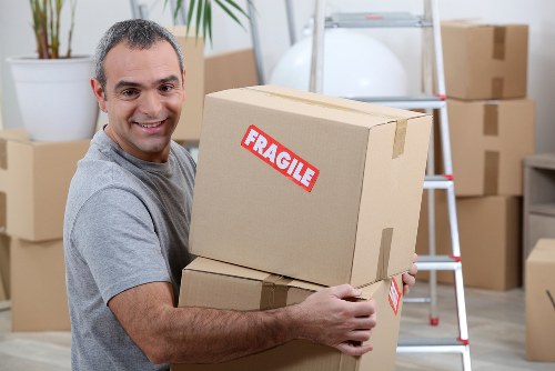 Removal van and moving boxes in Gidea Park residential street