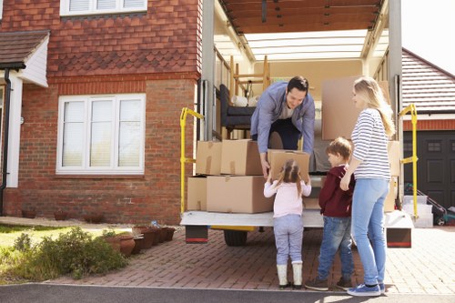 Professional movers loading a van during a Fulwell house move