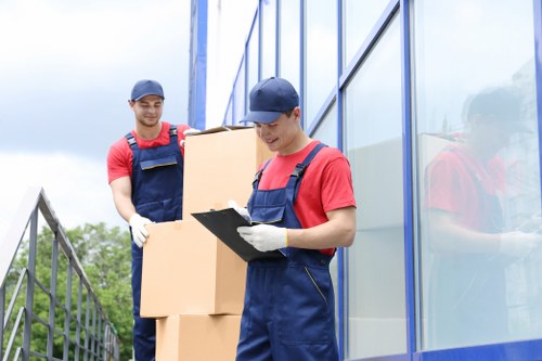 Removal team preparing a Kensington home move with packing boxes