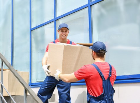 Removal van and moving boxes in New Cross street
