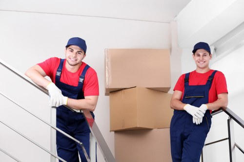 Local removals team handling furniture in Acton