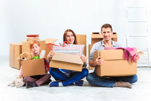 Careful furniture moving during a house removal in West Green