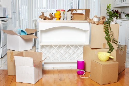 Local moving team handling furniture in London street