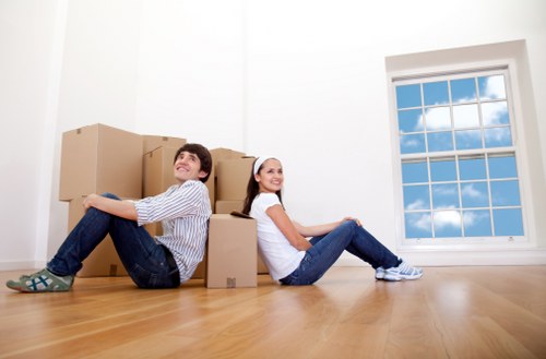 Family settling into a new home after removals in Poplar
