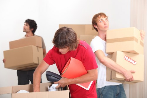 Professional movers handling a flat removal in West Green
