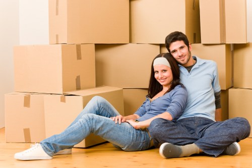 Packed boxes and removals van for a flat move in London