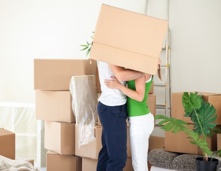 Packed moving boxes and furniture ready for Kingsbury relocation