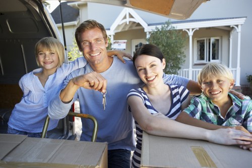 Professional movers handling furniture in Sutton