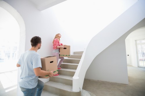 Professional movers packing household items in Hook