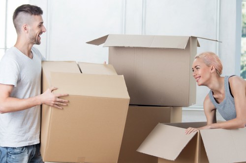 Professional packers preparing household items for transport