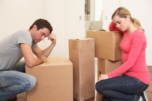 Organised moving boxes and furniture in a London home removal setting