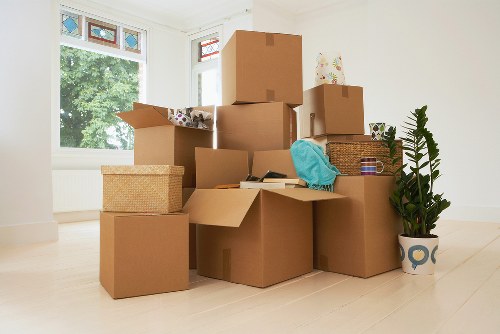 Team handling furniture removals in West Kensington flat
