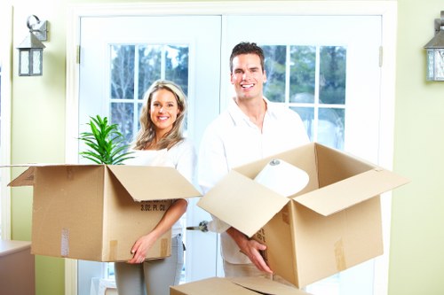 Professional movers carrying furniture safely