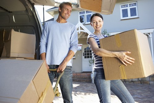 Professional movers carefully handling furniture during a Chinatown relocation
