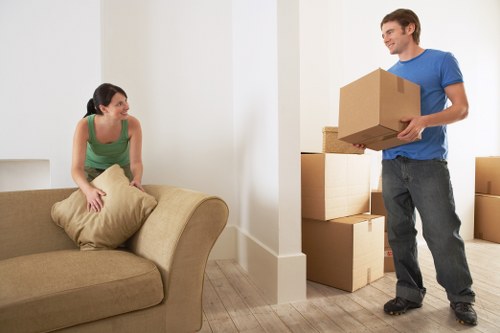Professional movers loading furniture for a Bexleyheath home move